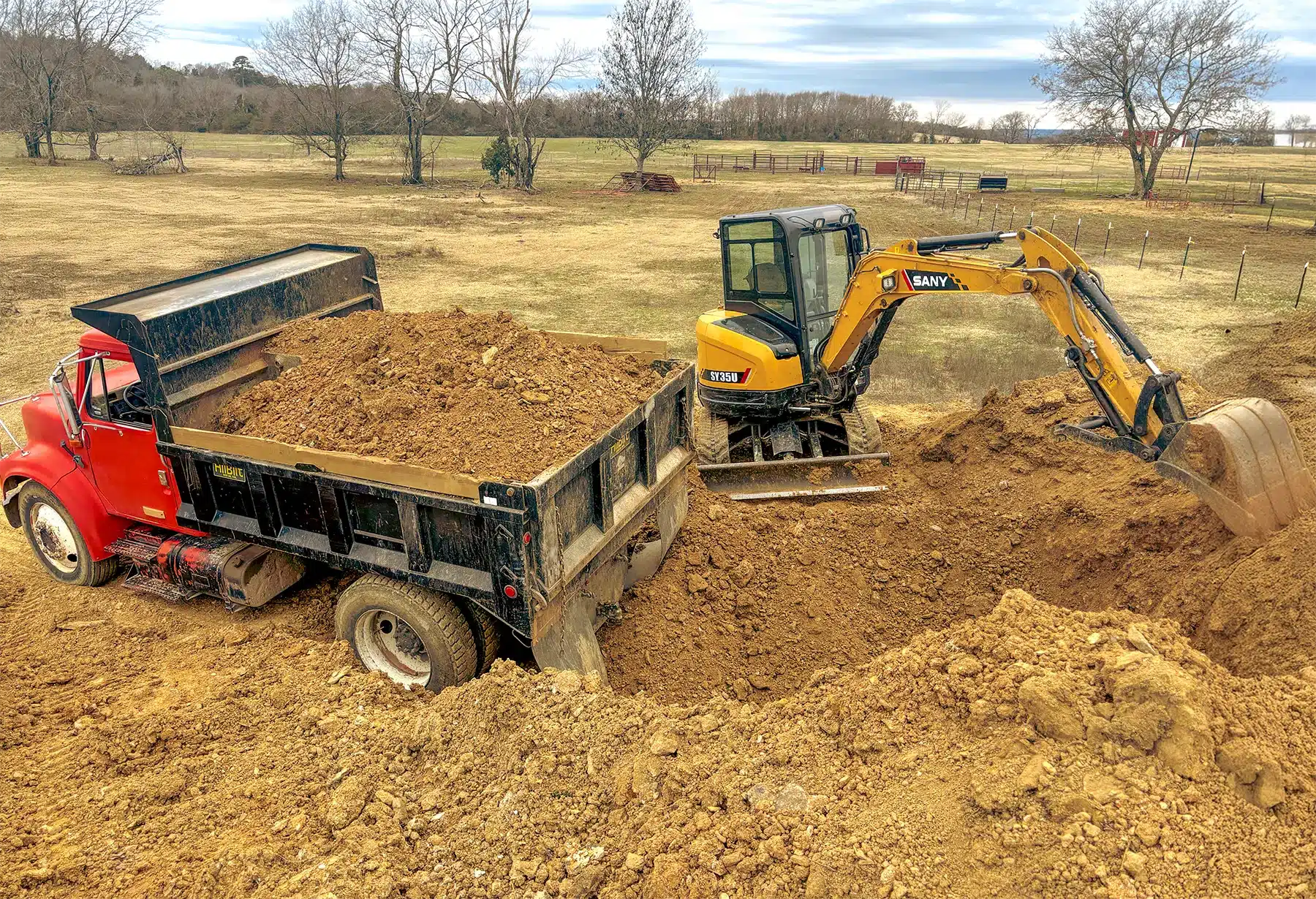 HP - Excavator loading Truck with Dirt